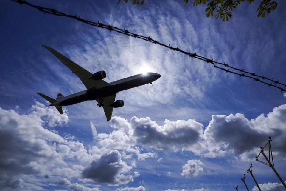 A plane lands on the southern runway at London Heathrow Airport. (Steve Parsons/PA) (PA Wire)