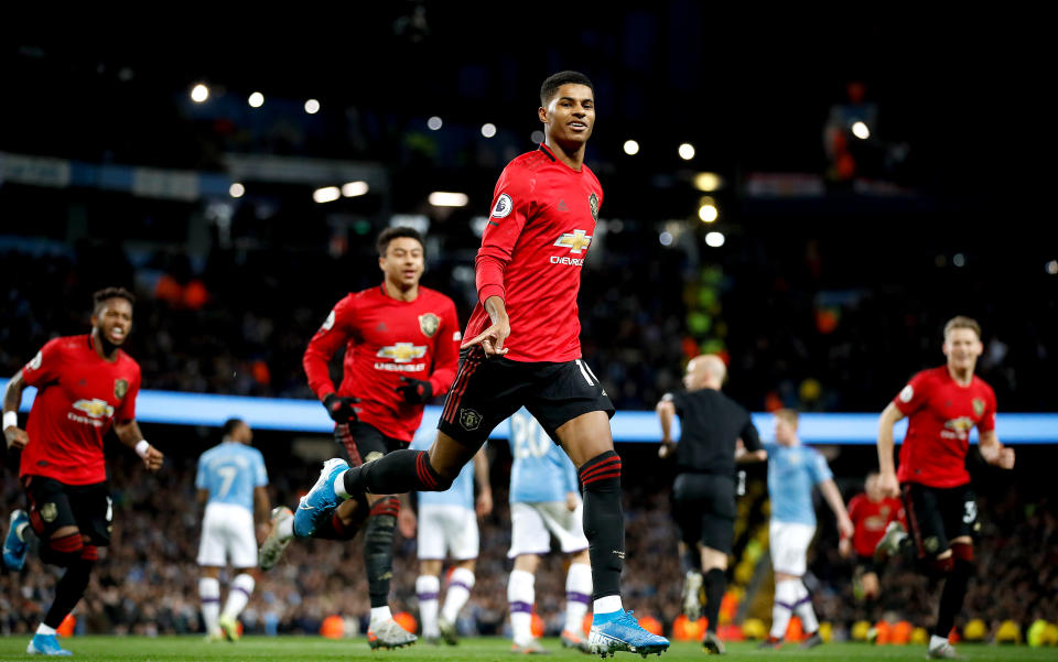 Manchester United's Marcus Rashford celebrates scoring his side's first goal of the game during the Premier League match at the Etihad Stadium, Manchester. (Photo by Martin Rickett/PA Images via Getty Images)