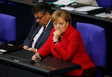 German Foreign Minister Sigmar Gabriel and Chancellor Angela Merkel are seen during a session of the Bundestag in Berlin, Germany, November 21, 2017. REUTERS/Axel Schmidt