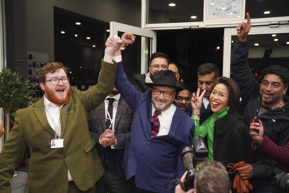 George Galloway, center, holds a rally at his Rochdale headquarters after being declared winner of the Rochdale by-election, which was triggered after the death of Labour Party's member of parliament Tony Lloyd, in Rochdale, England, Thursday, Feb. 29, 2024. (Peter Byrne/PA via AP)