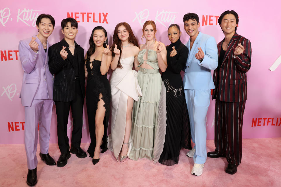 Sang Heon Lee, Minyeong Choi, Gia Kim, Anna Cathcart, Jocelyn Shelfo, Regan Aliyah, Anthony Keyvan, and Peter Thurnwald making heart signs on the red carpet