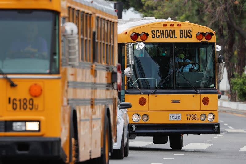 School bus drivers take part in caravan to demand proper funding for schools to support distant learning and a safe return to classes, in Los Angeles