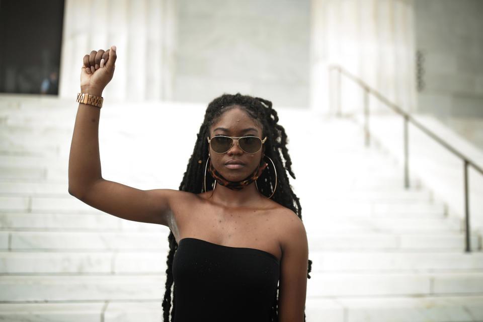 Aalayah Eastmond, a Parkland, Fla. activist, poses for a portrait after leading the crowd in chants at the Lincoln Memorial in Washington on Wednesday, June 10, 2020, during protests over the death of George Floyd, a Black man who died after being restrained by Minneapolis police officers on May 25. “As a young Black girl that survived a mass shooting at an affluent high school that was predominantly white, it played a huge role in my activism,” said the 19-year-old, who just finished her freshman year at Trinity Washington University. (AP Photo/Maya Alleruzzo)