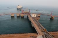 FILE PHOTO: A liquified natural gas (LNG) tanker leaves the dock after discharge at PetroChina's receiving terminal in Dalian