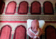 A muslim faithful attends prayers at the Makina mosque, during celebrations marking the Muslim holiday of Eid al-Adha amid the spread of the coronavirus disease (COVID-19), in Kibera settlement of Nairobi, Kenya July 31, 2020. REUTERS/Thomas Mukoya