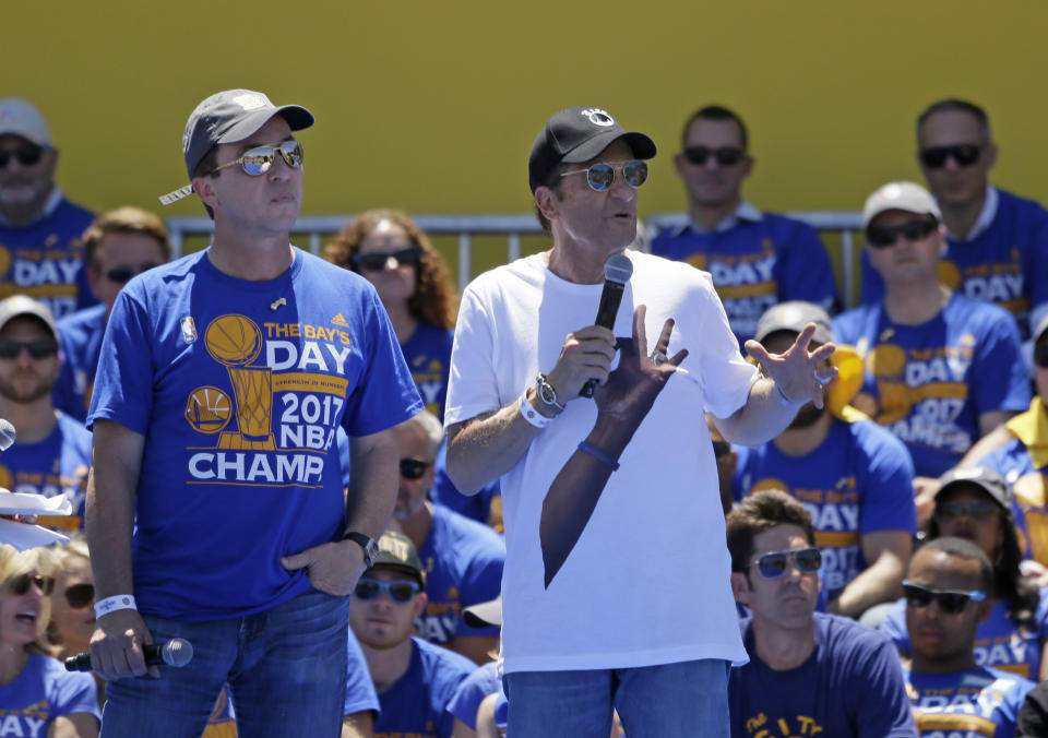 Warriors owners Joe Lacob (left) and Peter Guber pledged to foot the bill for the team’s championship parade in June. (AP)