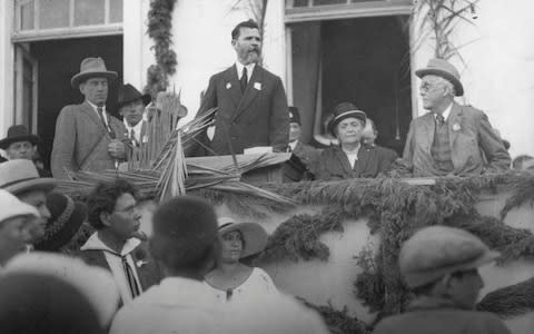 Lord Balfour listens to an address during his 1925 visit to Palestine. - Credit: Hulton Deutsch/Corbis Historical