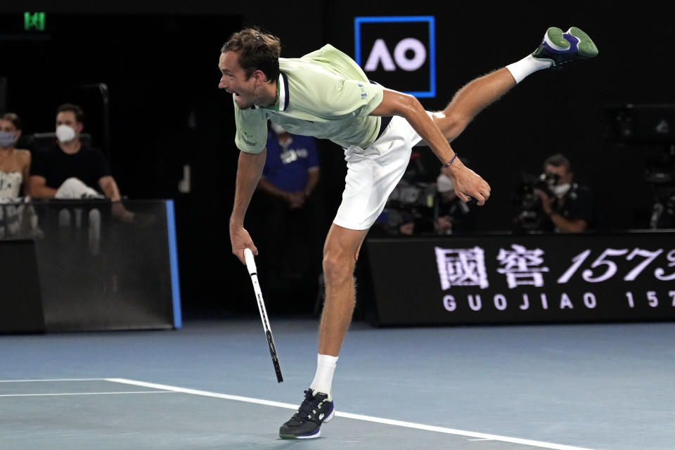 Daniil Medvedev of Russia serves to Stefanos Tsitsipas of Greece during their semifinal match at the Australian Open tennis championships in Melbourne, Australia, Friday, Jan. 28, 2022. (AP Photo/Simon Baker)