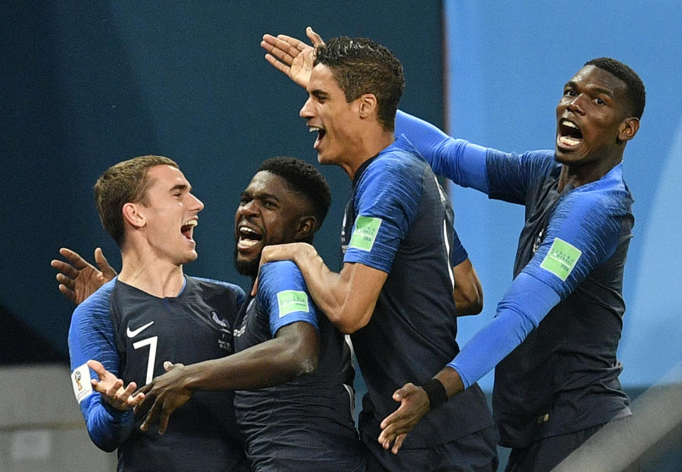 <p>France’s Samuel Umtiti, second from left, is congratulated by his teammates France’s Antoine Griezmann, Raphael Varane and Paul Pogba, from left, after scoring the opening goal during the semifinal match between France and Belgium at the 2018 soccer World Cup in the St. Petersburg Stadium in St. Petersburg, Russia, Tuesday, July 10, 2018. (AP Photo/Martin Meissner) </p>