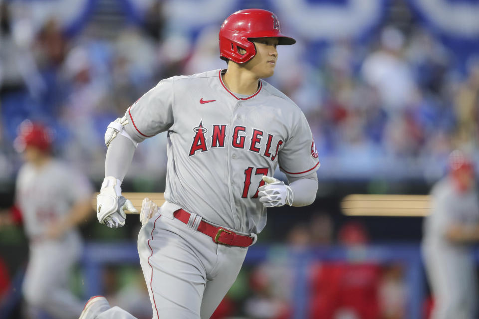 Los Angeles Angels' Shohei Ohtani watches his three-run double against the Toronto Blue Jays during the second inning of a baseball game Friday, April 9, 2021, in Dunedin, Fla. (AP Photo/Mike Carlson)