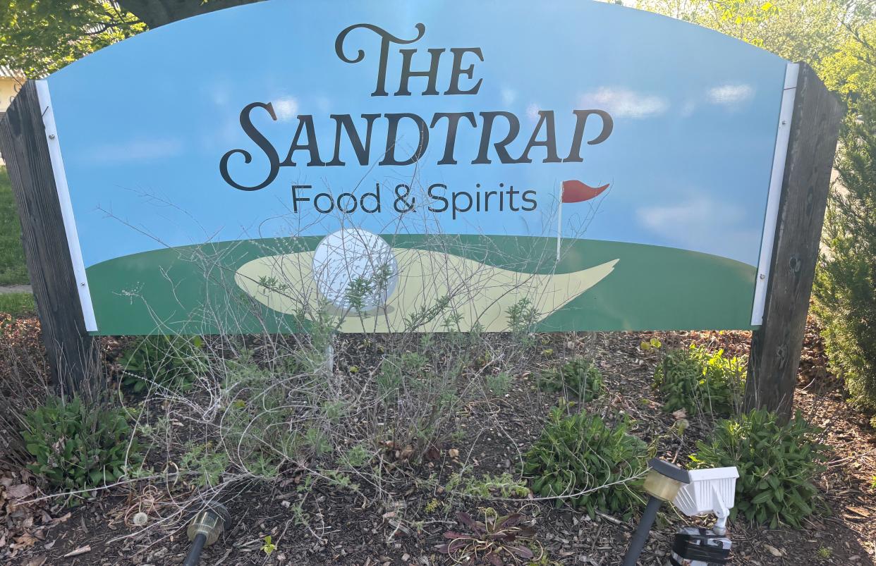 The Sandtrap is a new restaurant and bar now open in Riverview with views of a golf course.