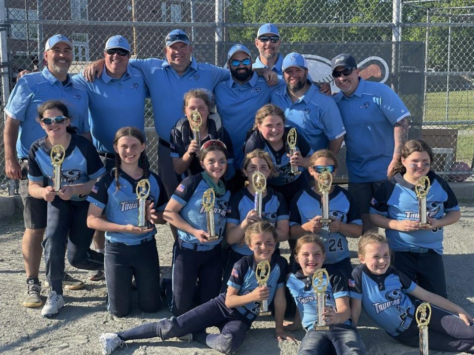 The 2023 Taunton Tornadoes U10 travel softball team show off their trophies after winning the Middleboro/Carver Youth Softball League Spring Fling in Middleboro on May 7, 2023.