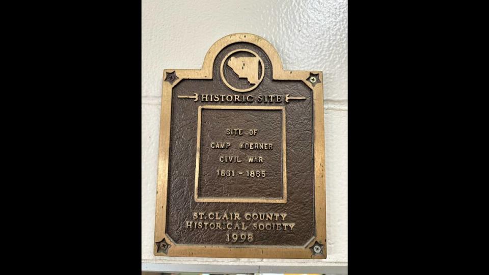 A plaque for Camp Koerner sits above the welcome desk at the Belle-Clair Fairgrounds. The plaque is a historical marker, but it does not detail the history behind Camp Koerner.