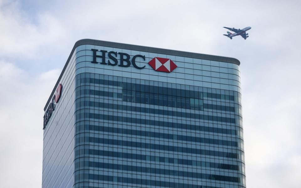 An aircraft passes over the top of the global headquarters for HSBC Holdings Plc in Canary Wharf financial, business and shopping district, in London, U.K., on Thursday, Jan. 7, 2021. Persimmon Plc, the U.K.â€™s biggest housebuilder, said the long-term outlook for the countryâ€™s housing market remained resilient despite the economic gloom and latest national lockdown. Photographer: Hollie Adams/Bloomberg - Hollie Adams/Bloomberg