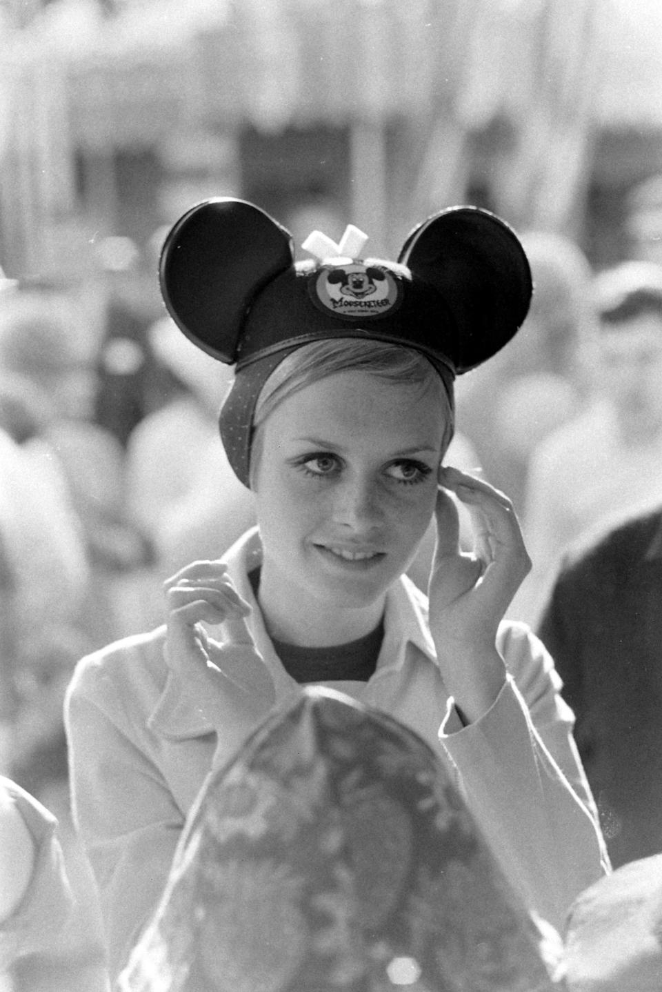 Model Twiggy wears mouse ears during a visit to&nbsp;Disneyland in 1967.