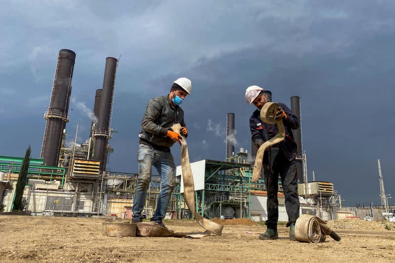 Workers are seen at Gaza's lone power plant, in the central Gaza Strip