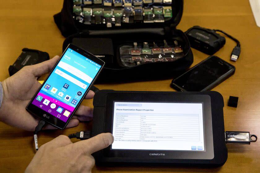 An engineer shows devices and explains the technology developed by the Israeli firm Cellebrite's technology on November 9, 2016 in the Israeli city of Petah Tikva. It only takes a few seconds for an employee of Cellebrite's technology, one of the world's leading hacking companies, to take a locked smartphone and pull the data from it. / AFP / JACK GUEZ (Photo credit should read JACK GUEZ/AFP via Getty Images)