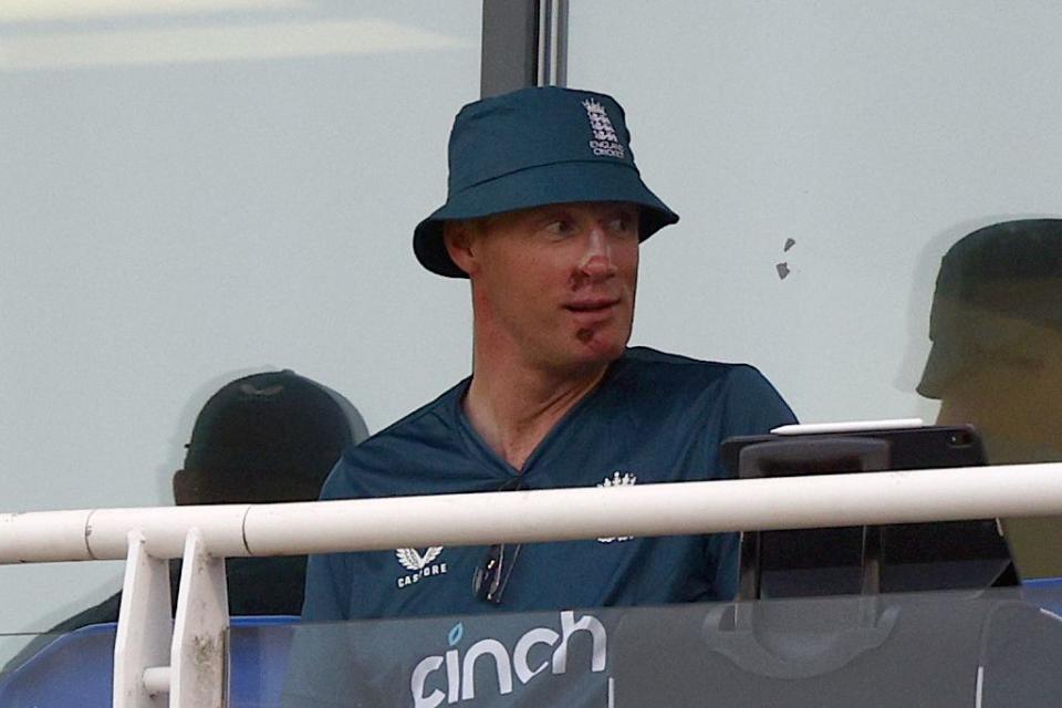 andrew freddie flintoff attends england v new zealand cricket match, he is wearing a blue bucket hat and a blue shirt and is looking off to his left