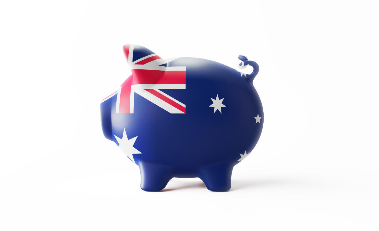 Piggy bank textured with Australian flag isolated on white background. Horizontal composition with copy space. Clipping path is included. Great use for savings concepts.