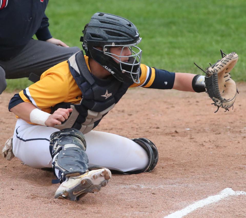 Seth Yacobucci of Tallmadge gets set to receive a pitch during the first inning against Cleveland Central Catholic in 2022.