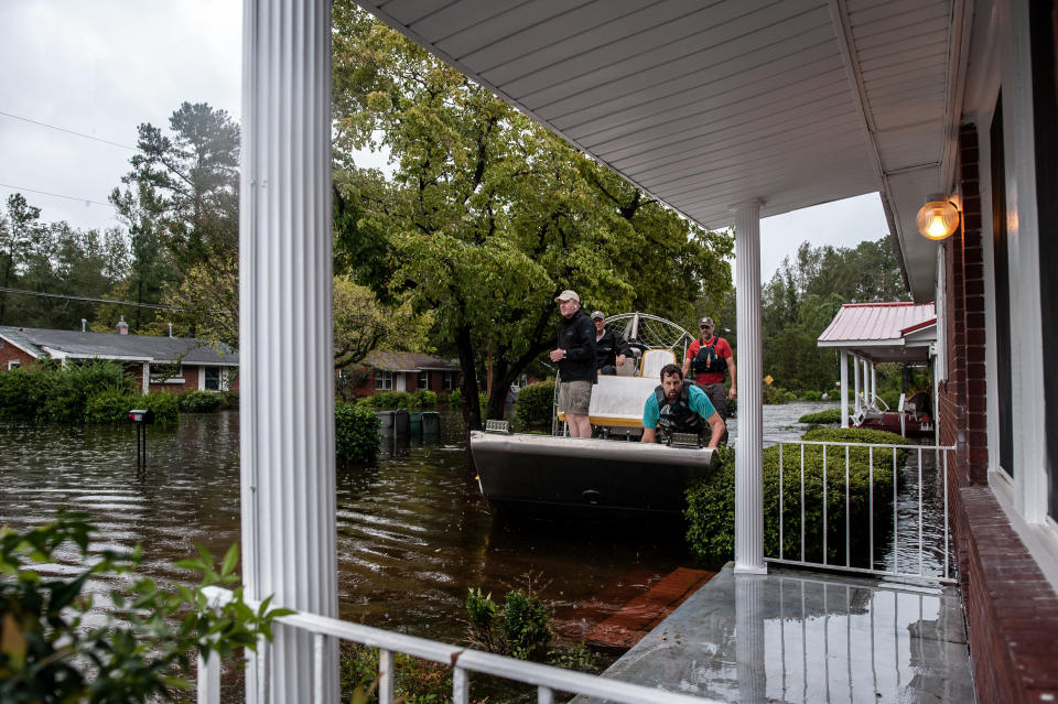 A boat crew with the Cajun Navy goes house to house to check for people in need of evacuation in Lumberton. (Photo: Joseph Rushmore for HuffPost)