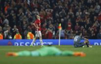 <p>Celta Vigo’s Sergio Alvarez and Jozabed look dejected after the match as Manchester United’s Ander Herrera celebrates </p>
