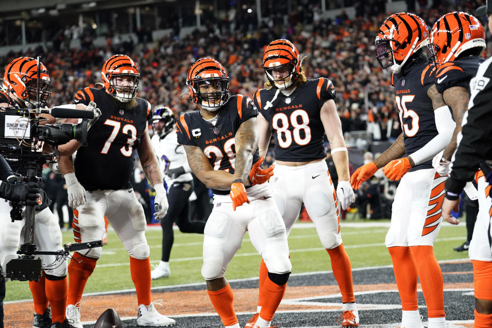 Cincinnati Bengals running back Joe Mixon (28) celebrates with teammates after a Bengals score in the first half of an NFL wild-card playoff football game against the Baltimore Ravens in Cincinnati, Sunday, Jan. 15, 2023. (AP Photo/Joshua A. Bickel)