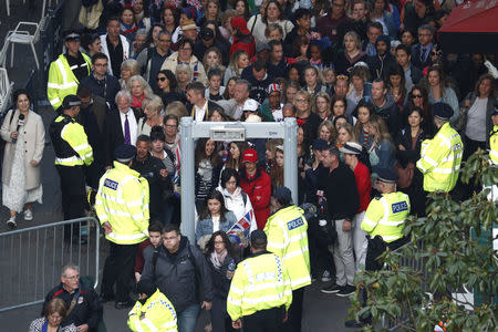 Members of the public pass a security screening as they arrive on castle hill ahead of the wedding and carriage procession of Britain's Prince Harry and Meghan Markle in Windsor, Britain, May 19, 2018. Odd ANDERSEN/Pool via REUTERS