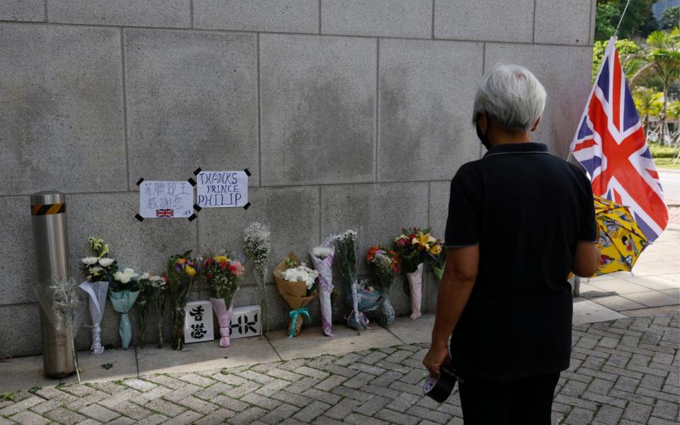 Flowers lie outside the British Consulate-General, Hong Kong, after Britain's Prince Philip, husband of Queen Elizabeth, died at the age of 99 - Tyrone Siu/Reuters