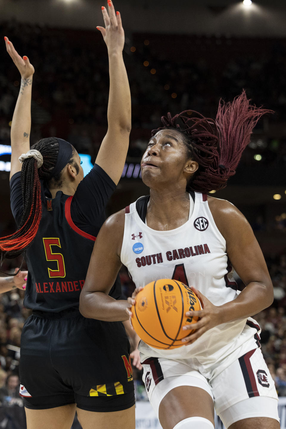 South Carolina's Aliyah Boston goes for a shot against Maryland's Brinae Alexander (5) in the first half of an Elite 8 college basketball game of the NCAA Tournament in Greenville, S.C., Monday, March 27, 2023. (AP Photo/Mic Smith)