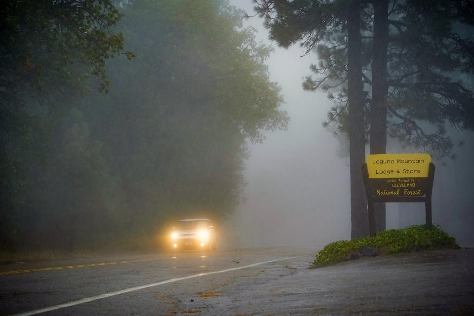 The effects of the expected storm reflects the lack of traffic on Sunrise Highway was to minimum at Mt Laguna on Friday, Sept. 9, 2022 in San Diego, Calif. A surge of clouds and showers associated with Tropical Storm Kay off Mexico's Baja California peninsula knocked the edge off temperatures in Southern California at times but also were a potential problem for solar generation. The storm was downgraded from a hurricane Thursday evening. (Nelvin C. Cepeda/The San Diego Union-Tribune via AP)