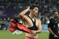 South Korea's Hwang Hee-chan celebrates after scoring his side's 2nd goal during the World Cup group H soccer match between South Korea and Portugal, at the Education City Stadium in Al Rayyan , Qatar, Friday, Dec. 2, 2022. (AP Photo/Hassan Ammar)