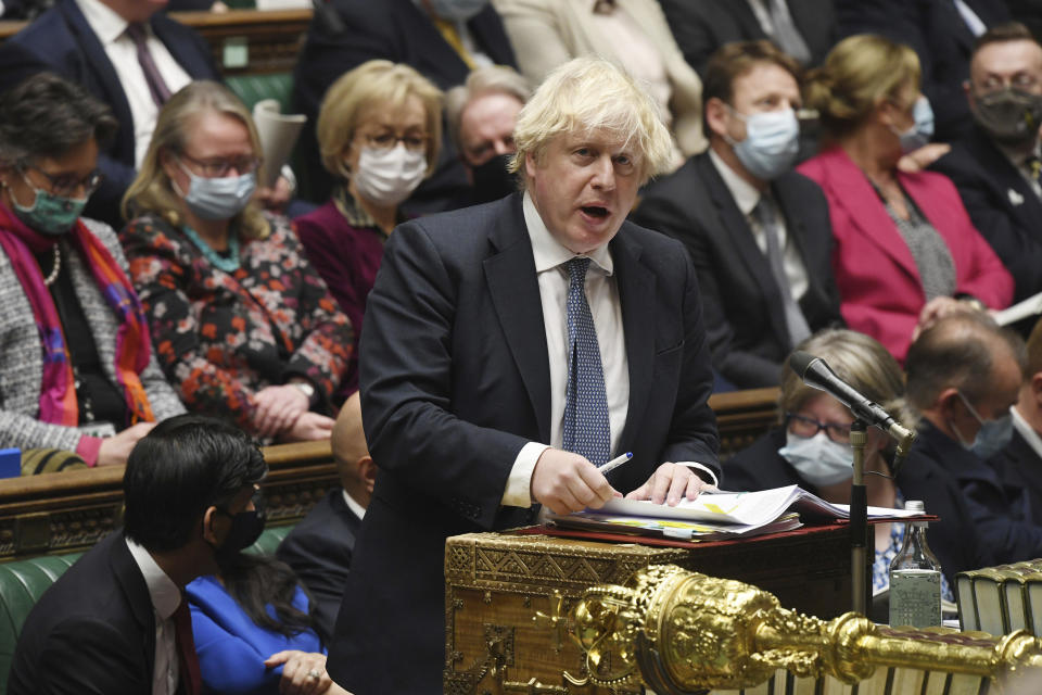 In this photo issued by UK Parliament, Britain's Prime Minister Boris Johnson speaks during Prime Minister's Questions in the House of Commons, London, Wednesday Dec. 8, 2021. (Jessica Taylor/UK Parliament via AP)