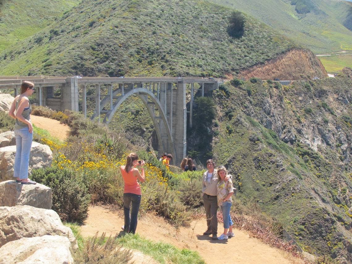 Tourists pose for photographs at Bixby Bridge in Big Sur, California. Greta Guest /Detroit Free Press/MCT