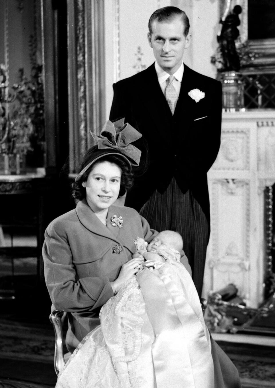 The Duke of Edinburgh and Princess Elizabeth with their son Prince Charles after his Christening ceremony