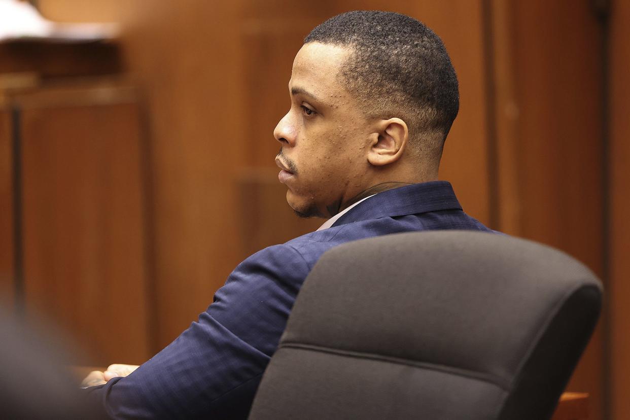 Eric Holder sits in the courtroom on the opening day of his trial, June 15, in Los Angeles.