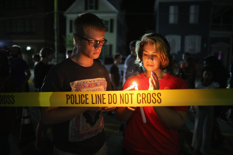 CHARLESTON, SC - JUNE 18:  Mourners light candles for the nine victims of last night's shooting at the historic Emanuel African Methodist Episcopal Church June 18, 2015 in Charleston, South Carolina. Dylann Storm Roof, 21, of Lexington, South Carolina, who allegedly attended a prayer meeting at the church for an hour before opening fire and killing three men and six women, was arrested today. Among the dead is the Rev. Clementa Pinckney, a state senator and a pastor at Emanuel AME, the oldest black congregation in America south of Baltimore, according to the National Park Service.  (Photo by Chip Somodevilla/Getty Images)