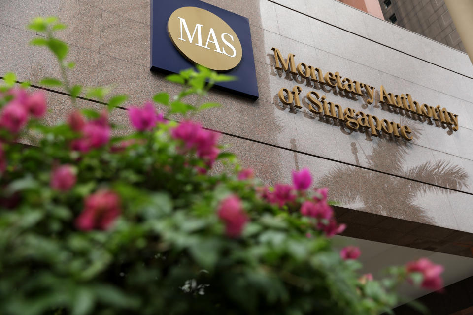 Signage for the Monetary Authority of Singapore is displayed outside the central bank’s headquarters in Singapore. Photographer: Paul Miller/Bloomberg via Getty Images