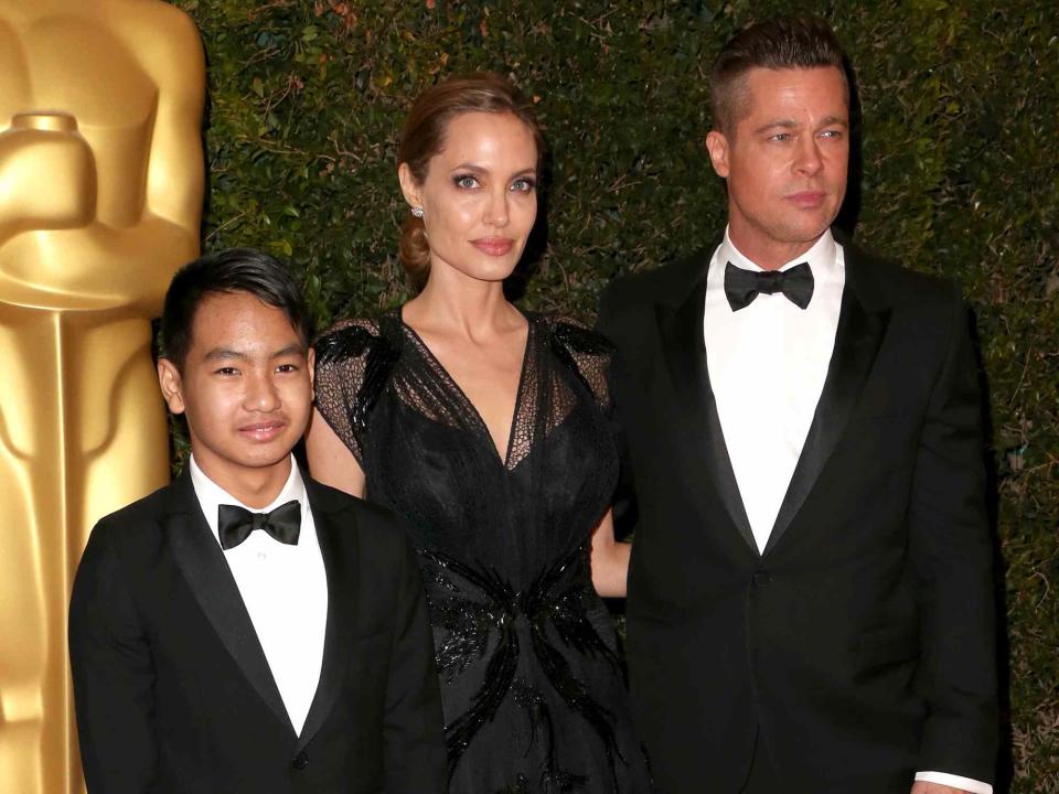 <p>Frederick M. Brown/Getty</p> Angelina Jolie and Brad Pitt with their oldest son Maddox Jolie-Pitt at the Academy of Motion Picture Arts and Sciences