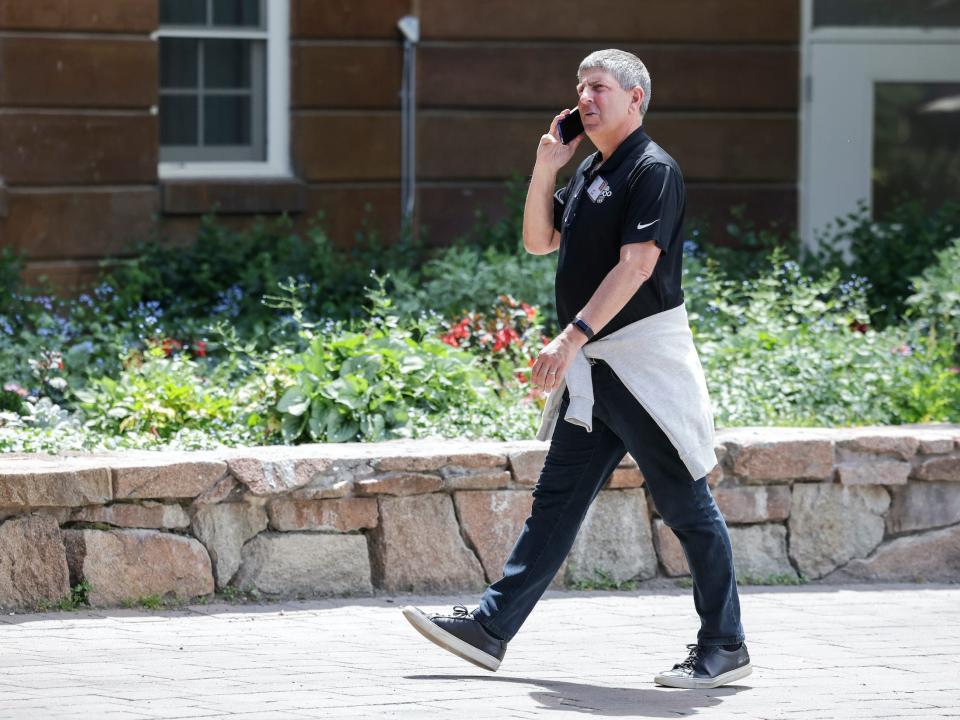 Jeff Shell, CEO of NBCUniversal, talks on the phone while walking at Sun Valley