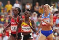 Athletics - Gold Coast 2018 Commonwealth Games - Women's 800m - Heats - Carrara Stadium - Gold Coast, Australia - April 12, 2018. Lynsey Sharp of Scotland, Emily Cherotich Tuei of Kenya and Winnie Nanyondo of Uganda. REUTERS/David Gray