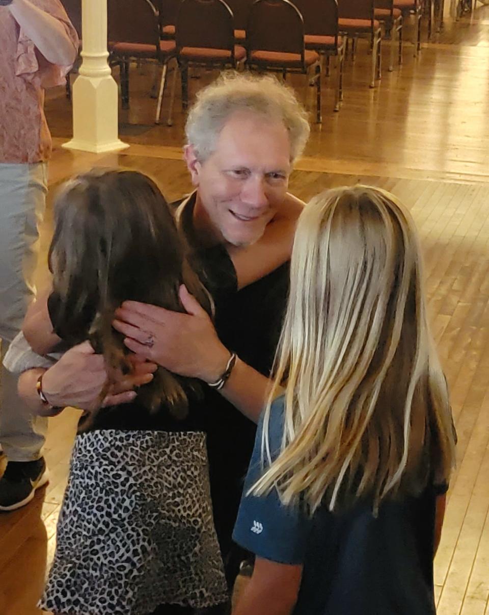 Warner took the time to greet each child as they exited the Goss Opera House. Some students asked for a hug.