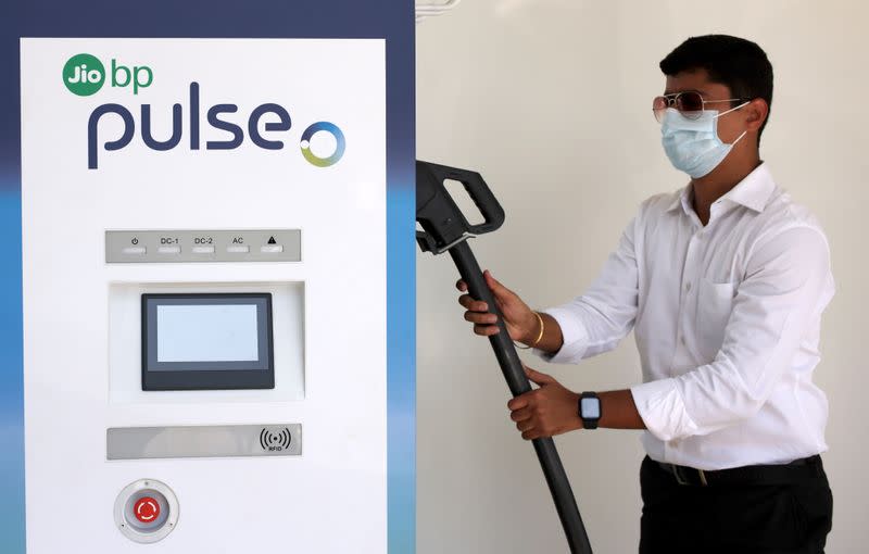 Man is seen at an Jio-bp electric vehicle (EV) charging point, in Navi Mumbai