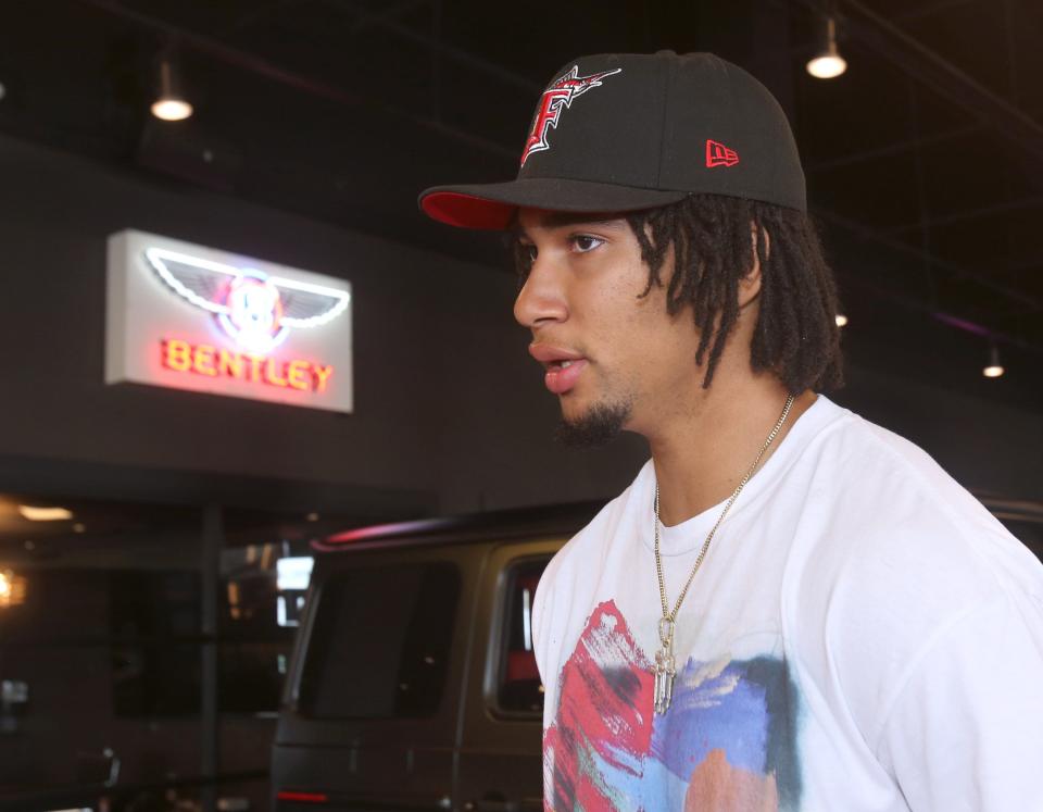 Ohio State quarterback CJ Stroud talks to the media after taking delivery of his Mercedes at Sarchione Auto Gallery in Jackson Township on Wednesday, June 8, 2022.