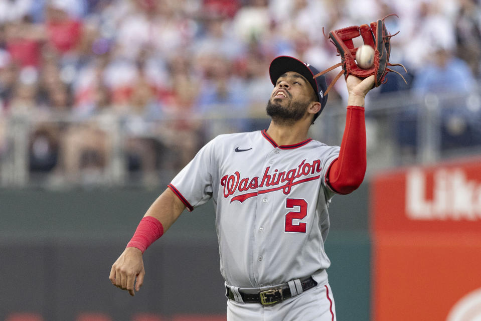 Washington Nationals second baseman Luis Garcia catches a fly ball from Philadelphia Phillies' J.T. Realmuto during the sixth inning of a baseball game Friday, June 30, 2023, in Philadelphia. (AP Photo/Laurence Kesterson)