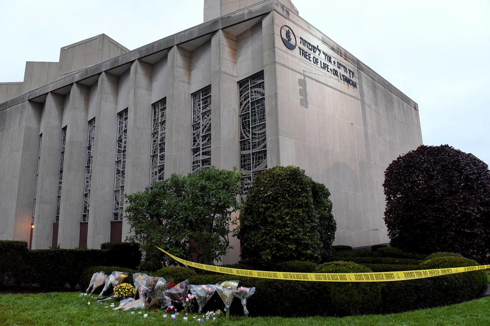 Flowers lay outside of the Tree of Life Congregation Synagogue in the Squirrel Hill neighborhood of Pittsburgh, Sunday, Oct. 28, 2018. 