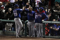 ST LOUIS, MO - OCTOBER 19: Mike Napoli #25 and Adrian Beltre #29 of the Texas Rangers celebrate with manager Ron Washington after Napoli hit a two-run homerun in the top of the fifth inning during Game One of the MLB World Series against the St. Louis Cardinals at Busch Stadium on October 19, 2011 in St Louis, Missouri. (Photo by Jamie Squire/Getty Images)