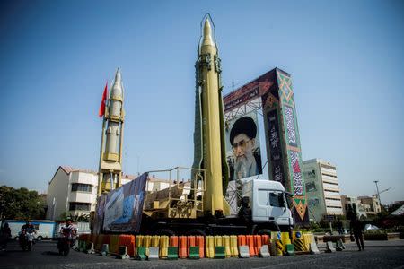 FILE PHOTO: FILE PHOTO: A display featuring missiles and a portrait of Iran's Supreme Leader Ayatollah Ali Khamenei is seen at Baharestan Square in Tehran, Iran September 27, 2017. Nazanin Tabatabaee Yazdi/TIMA via REUTERS