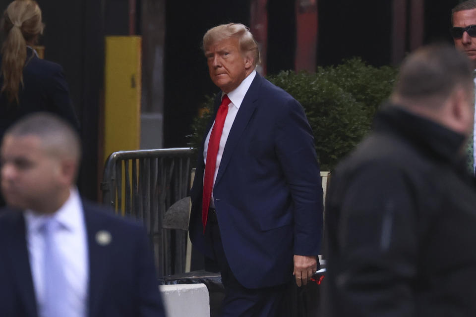 Former President Donald Trump arrives at Trump Tower, Monday, April 3, 2023, in New York. Trump arrived in New York on Monday for his expected booking and arraignment the following day on charges arising from hush money payments during his 2016 campaign. (AP Photo/Yuki Iwamura)