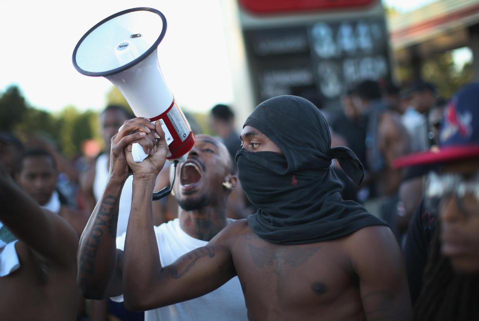 Demonstrators on Aug. 12, 2014, protest the killing of unarmed teenager Michael Brown a few days earlier.